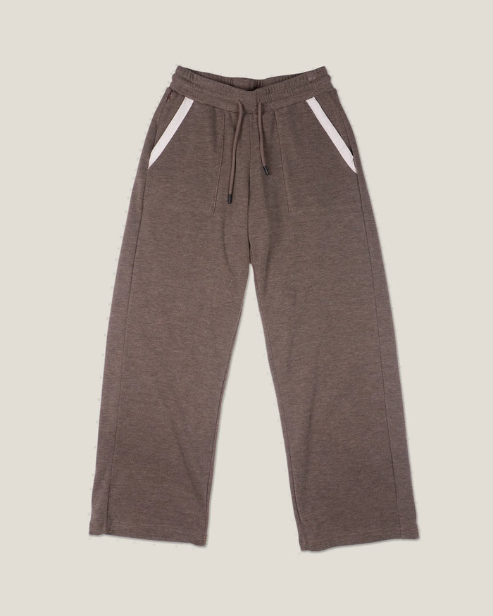 Wide-leg fleece sweatpants with drawstring waist and white-trimmed side pockets, front view