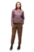 Women's quilted collarless jacket in dusty mauve with snap buttons, front view on model