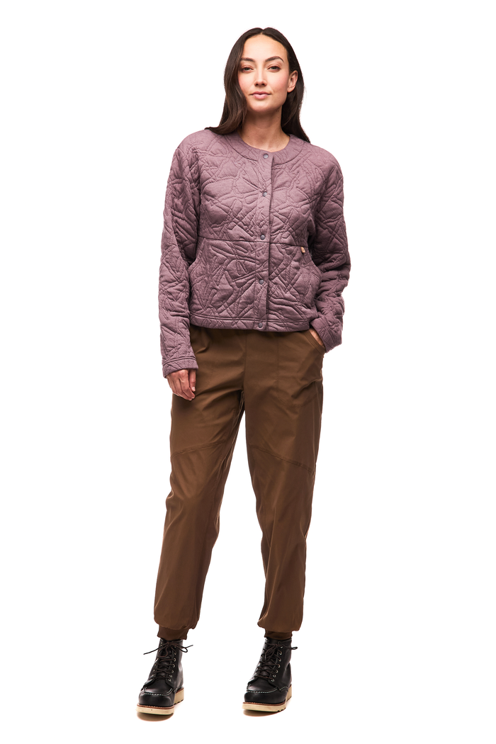 Women's quilted collarless jacket in dusty mauve with snap buttons, front view on model