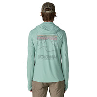 Light green hooded long sleeve shirt with mountain graphic on back, rear view