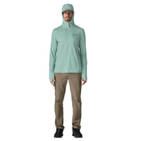 Light green hooded sun protection shirt with quarter-zip and thumb holes, modeled front view