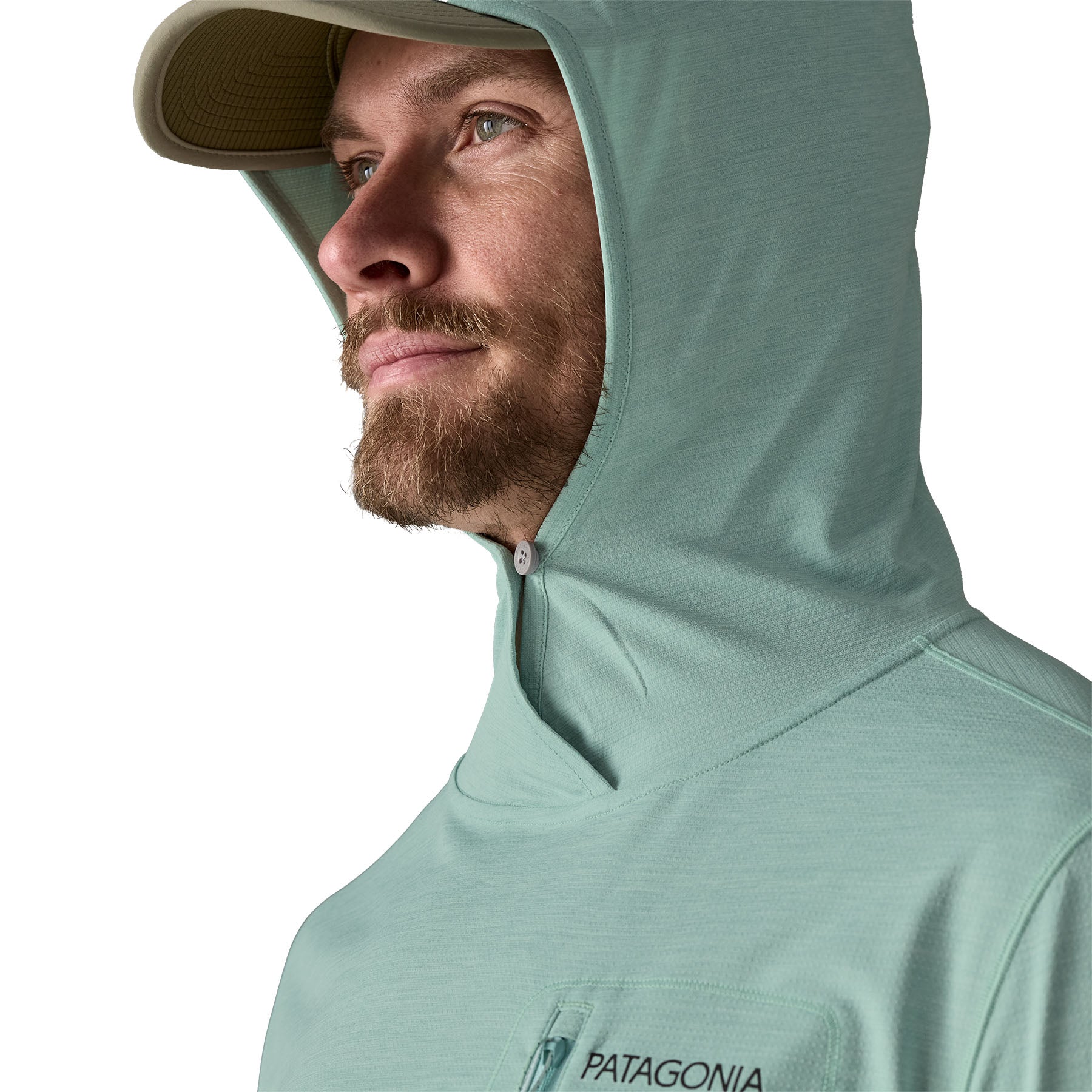 Sage green sun protection hoody with integrated cap visor and hood up, profile view