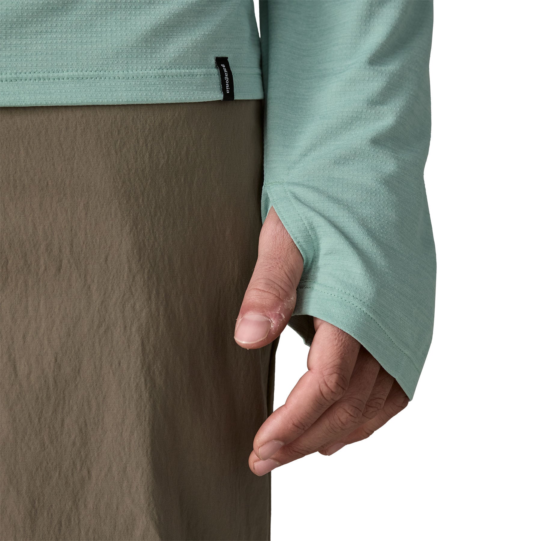 Light green long-sleeve hooded shirt with thumb holes, shown from side angle
