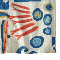 Button-up shirt with abstract painted pattern featuring blue circles and orange brushstrokes on cream fabric