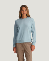 Women's lightweight crew neck sweatshirt in pale blue, long sleeves, ribbed cuffs and hem, front view