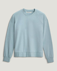 Light blue crewneck sweatshirt with raglan sleeves and ribbed cuffs, flat lay front view