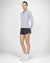 Women's long-sleeve quarter-zip pullover in light gray, front three-quarter view on model