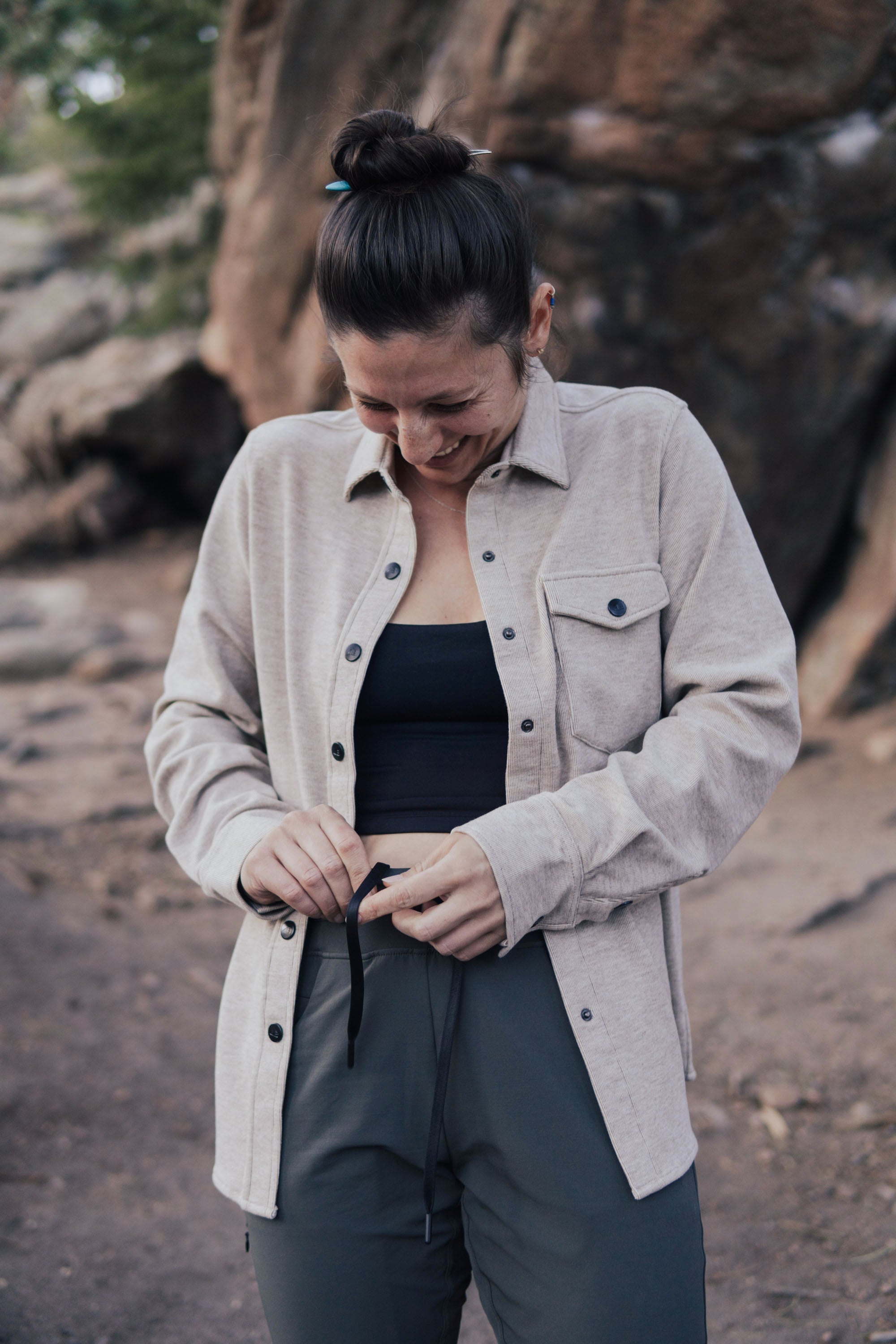 Women's fleece button-up shirt jacket in light beige, on-model lifestyle shot outdoors