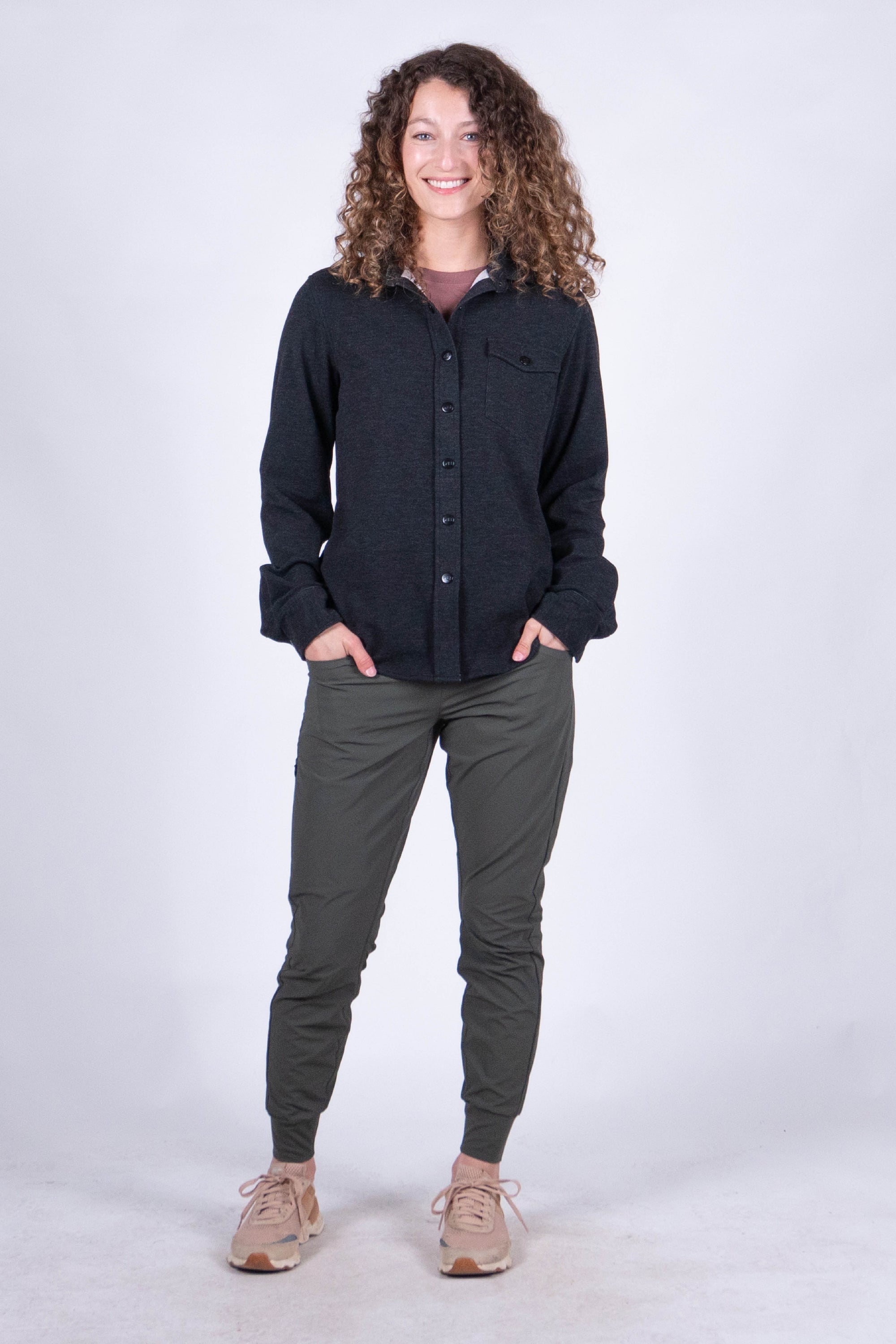 Women's fleece button-up shirt in dark charcoal, front view, long sleeves with chest pocket