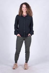 Women's fleece button-up shirt in dark charcoal, front view, long sleeves with chest pocket