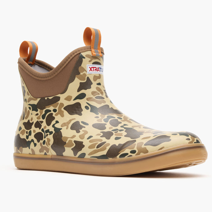 Ankle-height rubber deck boot with camouflage pattern, pull tabs, and gum rubber sole, side view