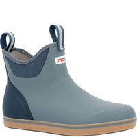Ankle-height rubber deck boot with pull tabs, navy accents, and tan gum sole, side view