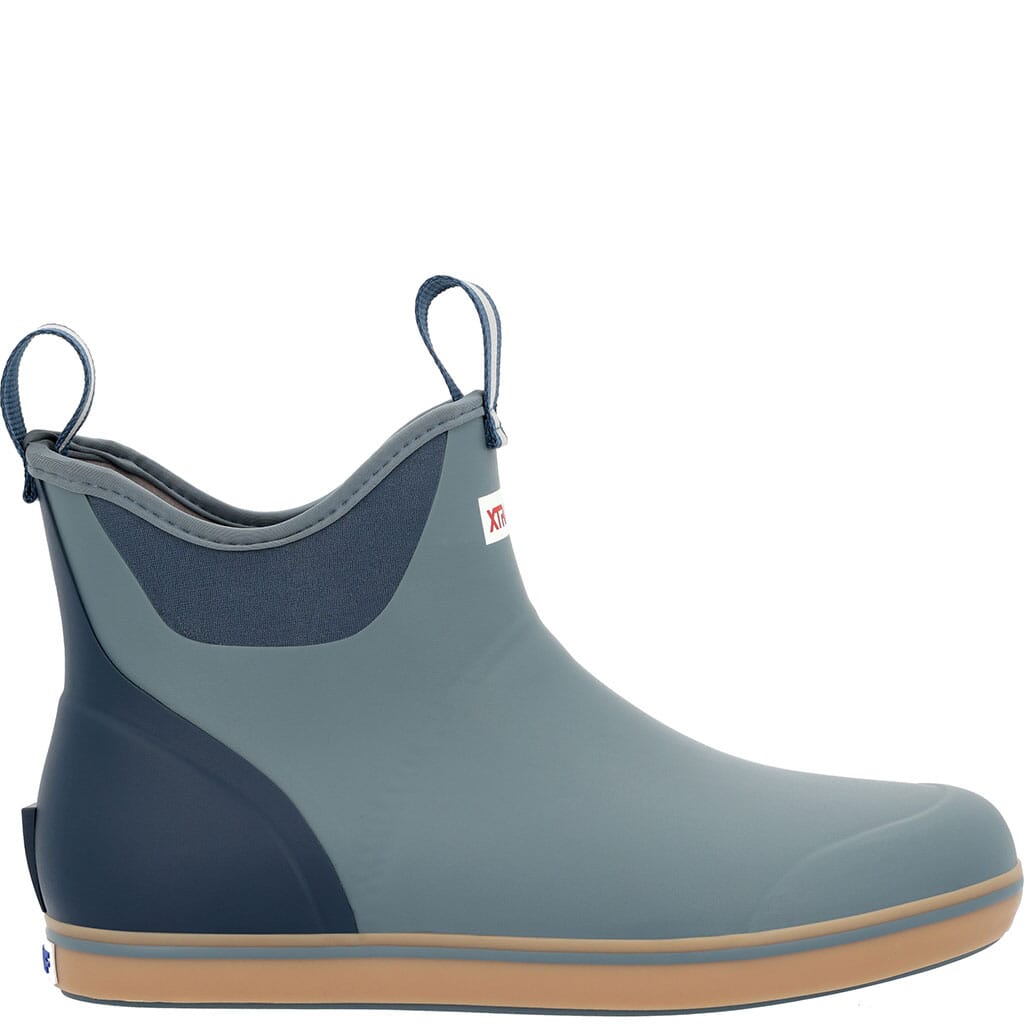 Ankle-height deck boot with gray-blue upper, navy accents, pull tabs, and tan rubber sole, side view