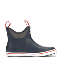 Men's ankle-height rubber deck boot in navy with red pull tabs and striped sole, side view