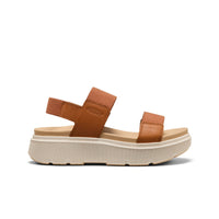 Brown leather platform sandal with two adjustable straps and textured cream sole, side view