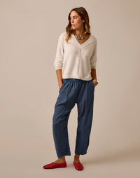 Navy blue wide-leg cropped pants with elastic waistband and subtle speckled pattern