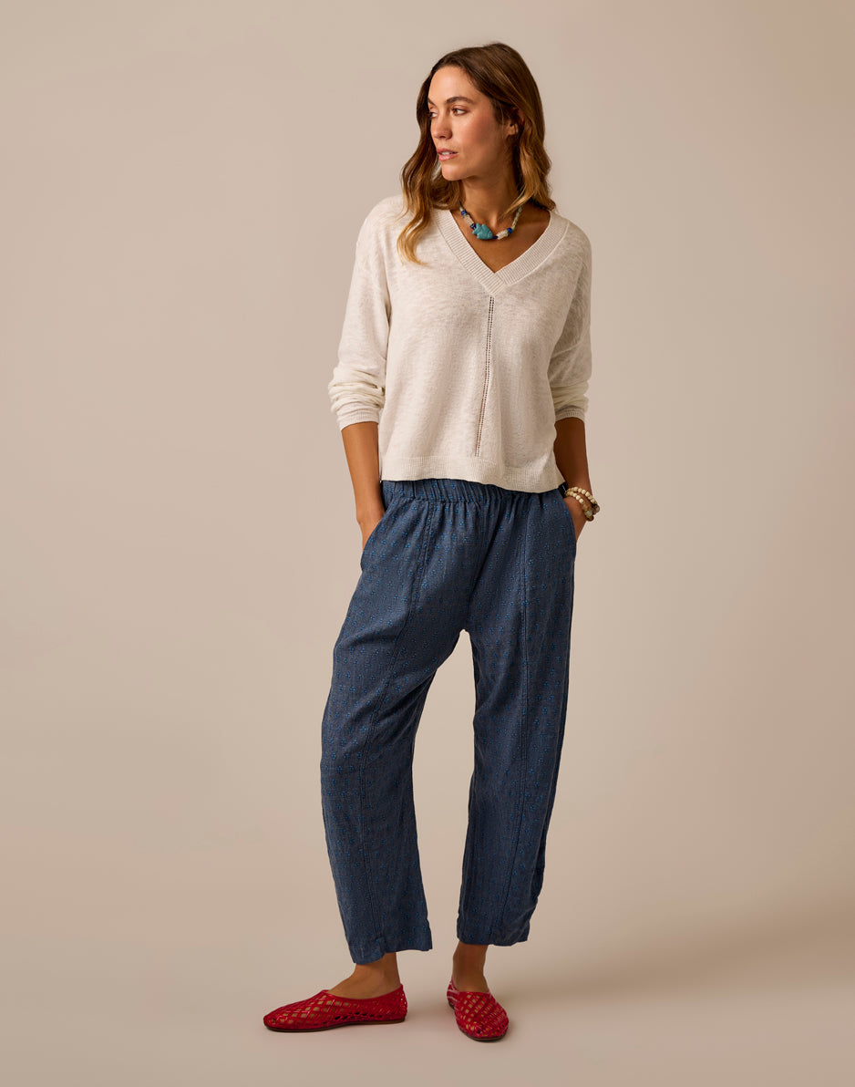 Navy blue wide-leg cropped pants with elastic waistband and subtle speckled pattern