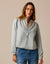 Women's lightweight denim pullover top with button placket and long sleeves, front view