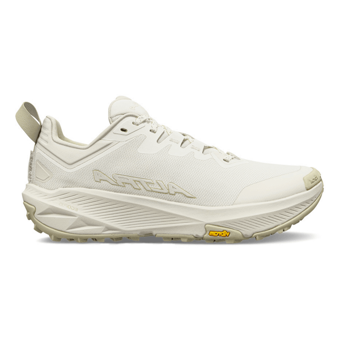 Women's trail running shoe in off-white, lateral side view, with aggressive lug outsole and heel pull tab