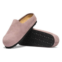Slip-on suede mule clogs shown from side and bottom angles, featuring black rubber sole