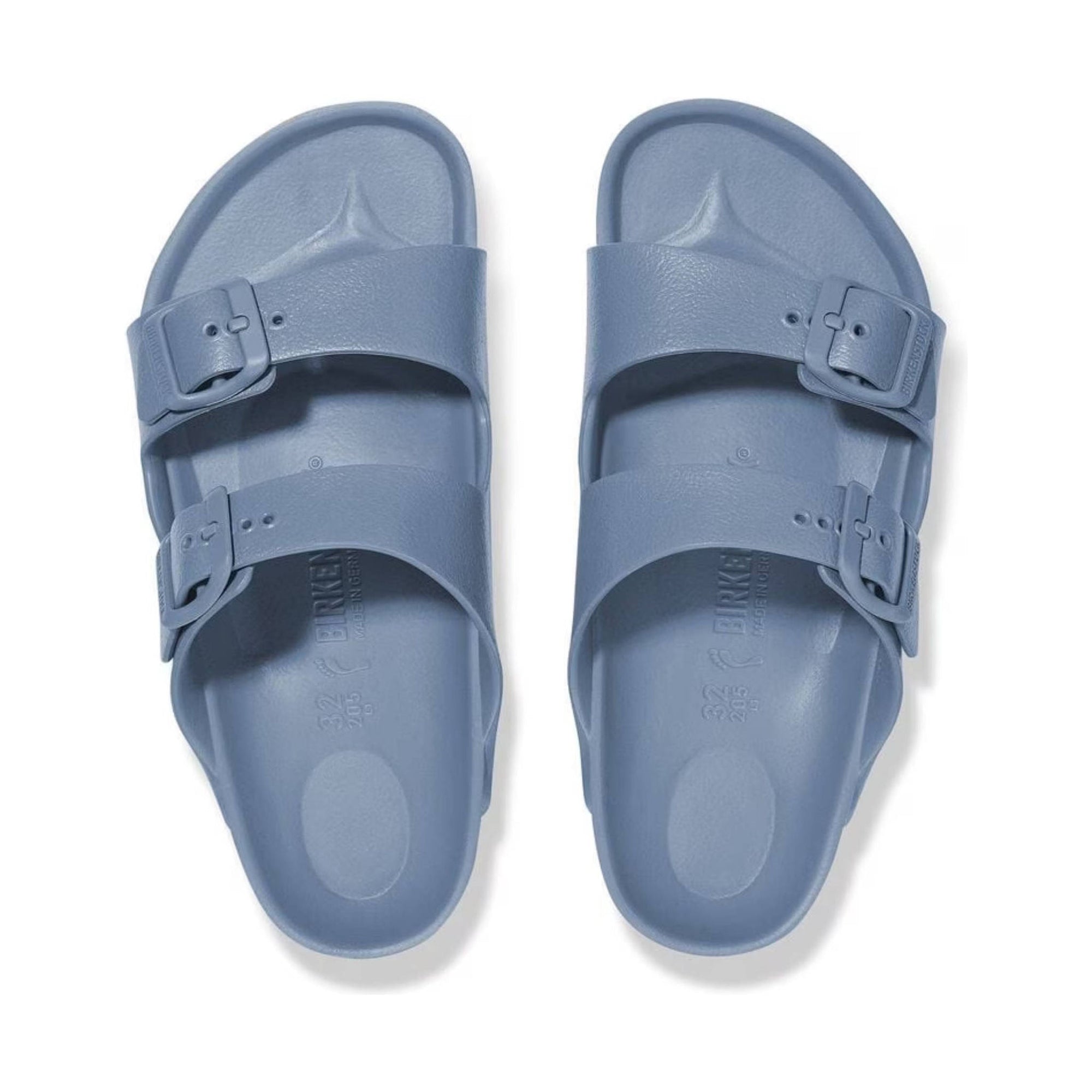 Pair of light blue two-strap sandals with adjustable buckles, top view on white background