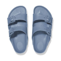 Pair of light blue two-strap sandals with adjustable buckles, top view on white background