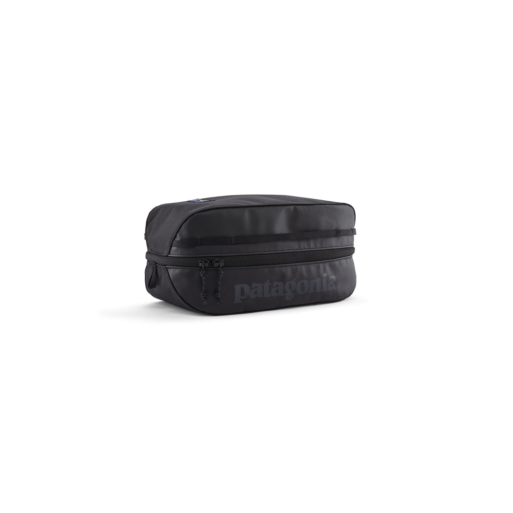 Black rectangular travel cube organizer bag with zipper closure and dual pull tabs, angled view