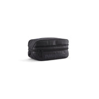 Black rectangular travel cube organizer bag with zipper closure and dual pull tabs, angled view