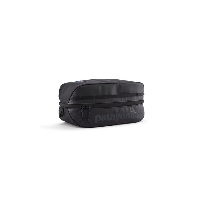 Black rectangular travel cube organizer bag with zipper closure and dual pull tabs, angled view