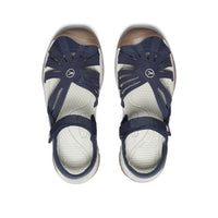 Navy blue closed-toe sandals with ankle straps and protective toe coverage, top view