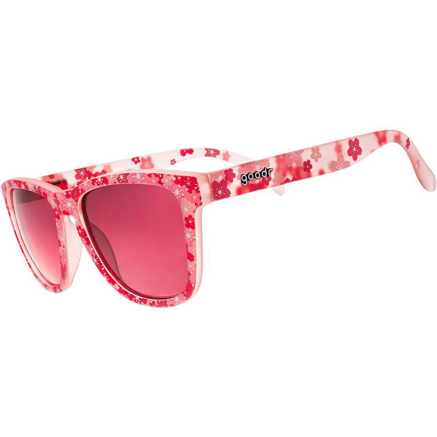 Pink floral patterned sunglasses with red gradient lenses on white background