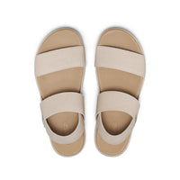 Women's elastic strap sandals with beige straps and tan footbed, top view