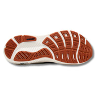 Running shoe sole view showing white midsole with orange rubber outsole tread pattern