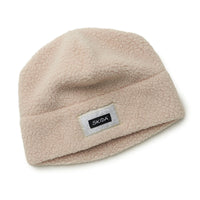 Light beige high-pile sherpa fleece beanie hat with folded cuff and brand patch label