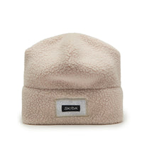 Cream sherpa fleece cuffed beanie with textured high-pile fabric and small brand patch, front view