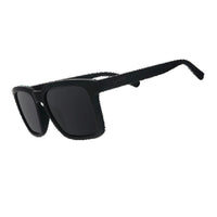Black rectangular sunglasses with dark lenses shown at three-quarter angle view
