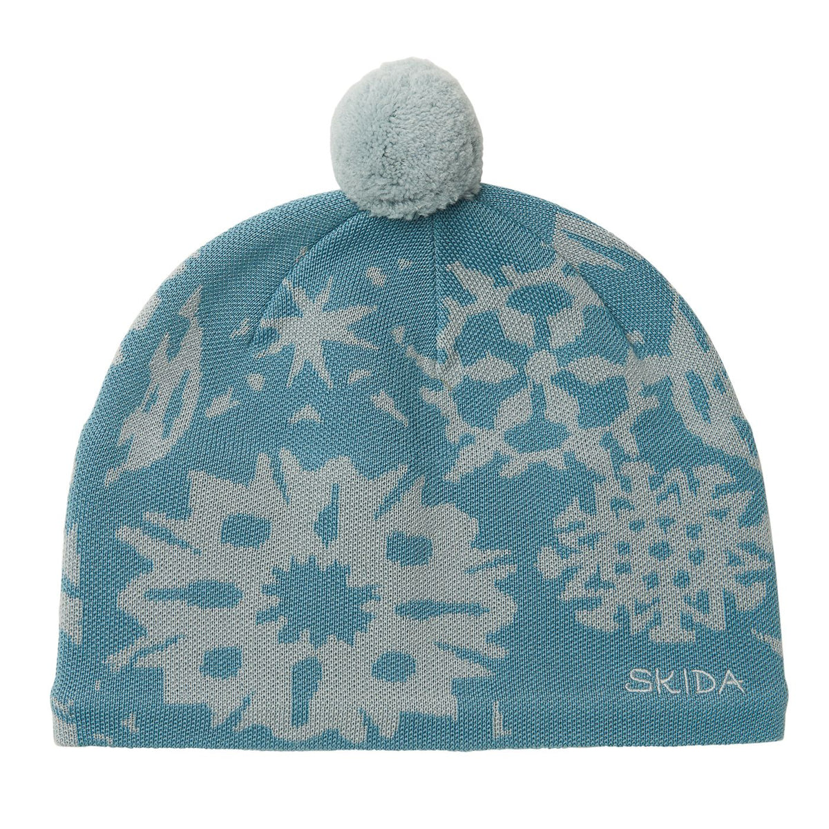Knit beanie with snowflake pattern in blue and grey, topped with a fluffy pom-pom