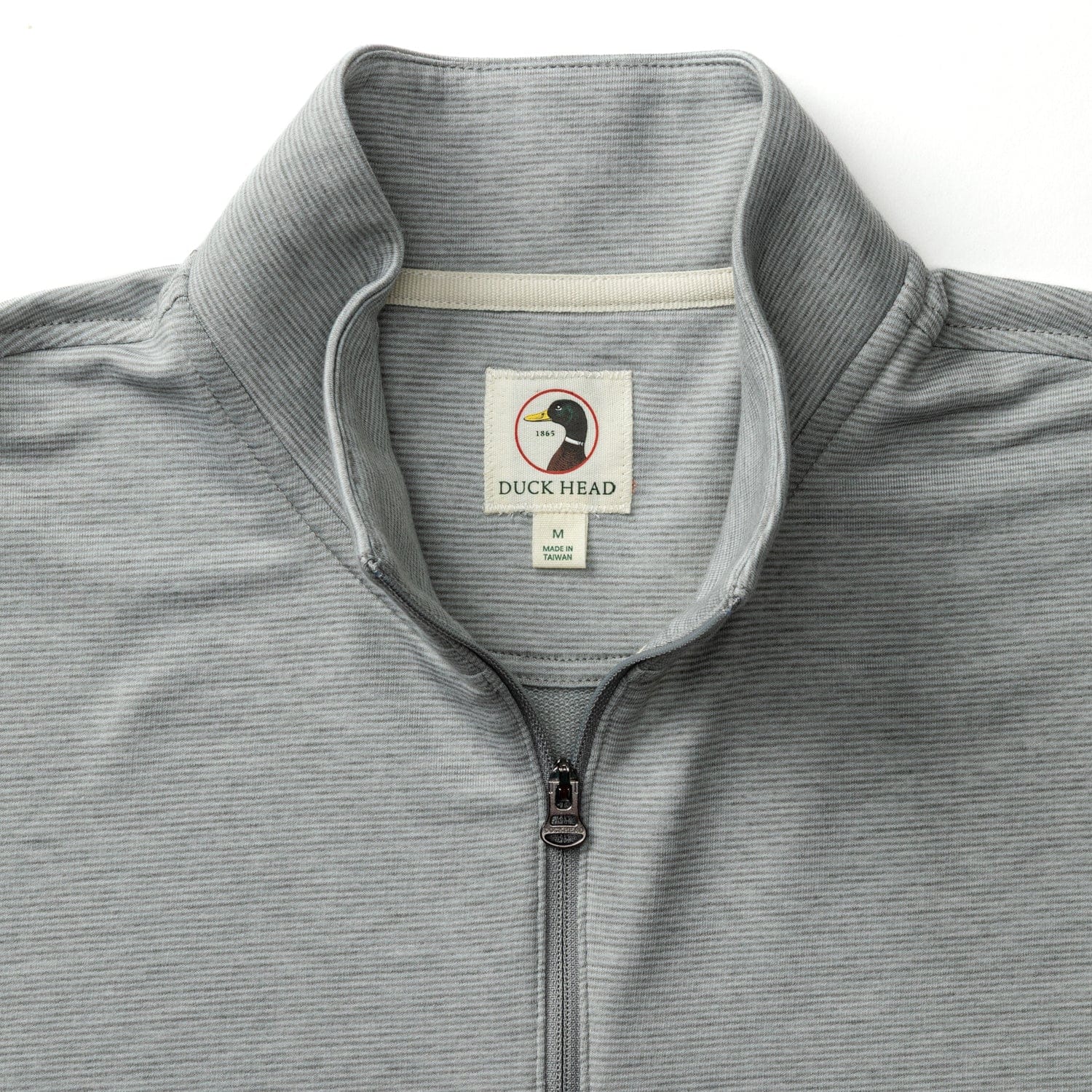 Light grey striped quarter-zip pullover with ribbed texture, collar detail shown