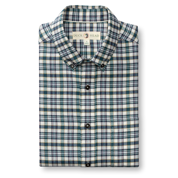 Folded plaid flannel button-down shirt with button-down collar, teal and navy checks on cream