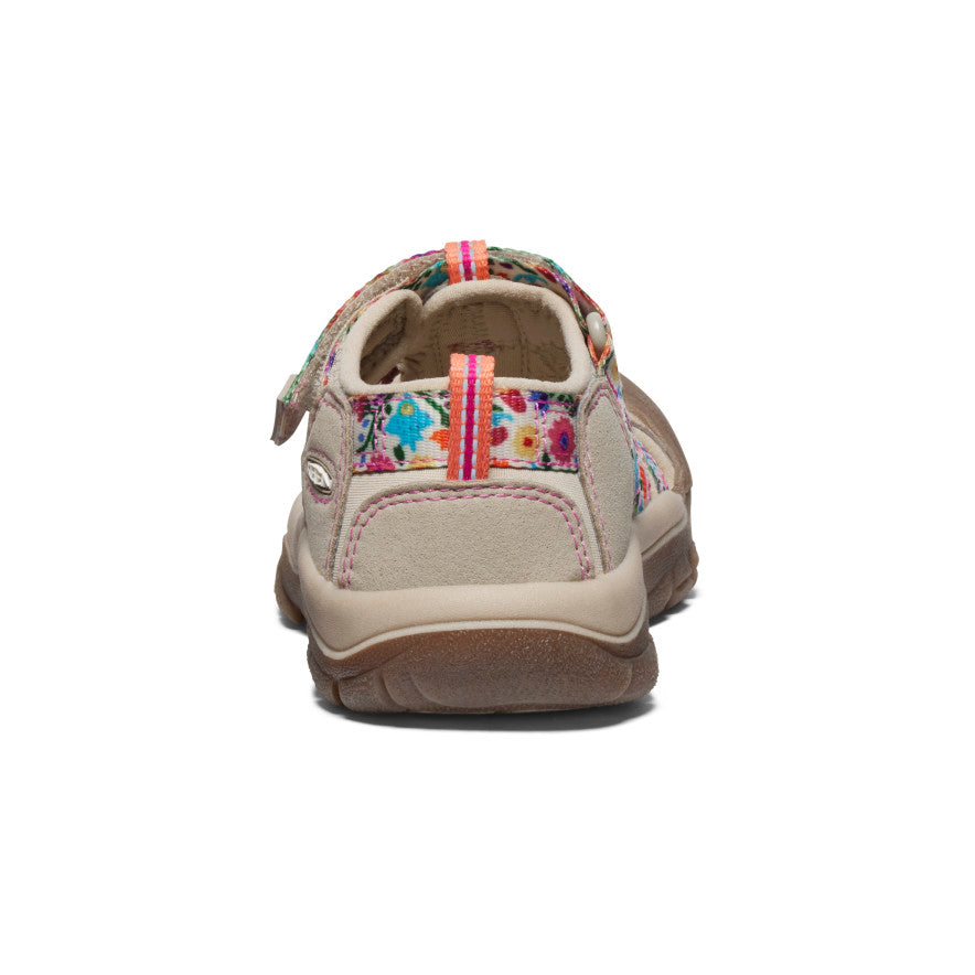 Children's closed-toe water sandal with beige base and colorful floral pattern, rear view