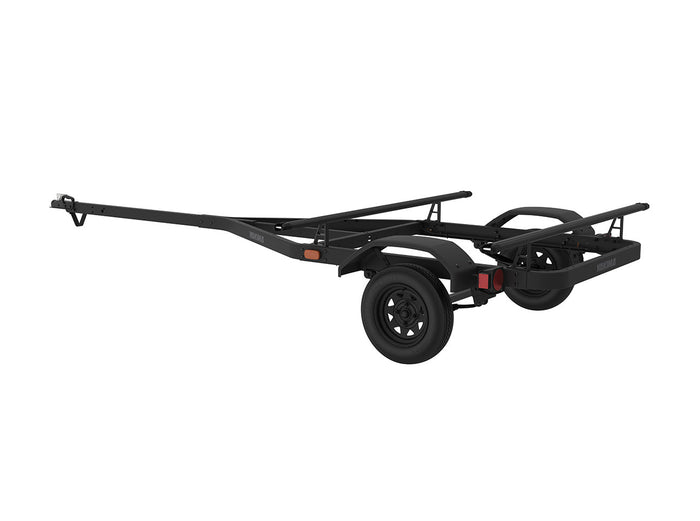 Black kayak trailer with adjustable crossbars and spare tire mount on white background