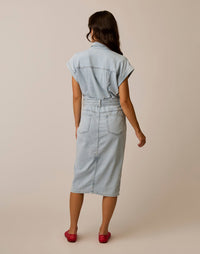 Women's sleeveless denim shirt dress with belt and back pockets, back view on model