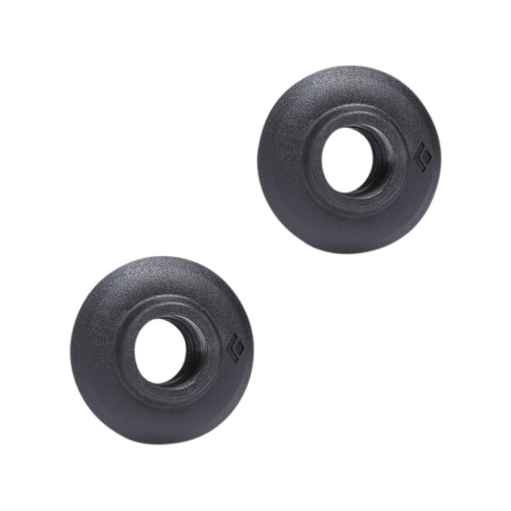 Pair of round black trekking pole baskets with central hole, top-down angle