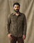 Men's quilted insulated shirt jacket in olive green with chest pockets, front view