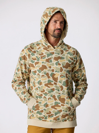 Men's camouflage pullover hoodie with kangaroo pocket, front view on model