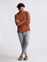 Men's lightweight fleece jogger pants in heather grey, full-body on-model view