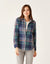 Women's plaid flannel button-up shirt in navy and green tartan, front view on model