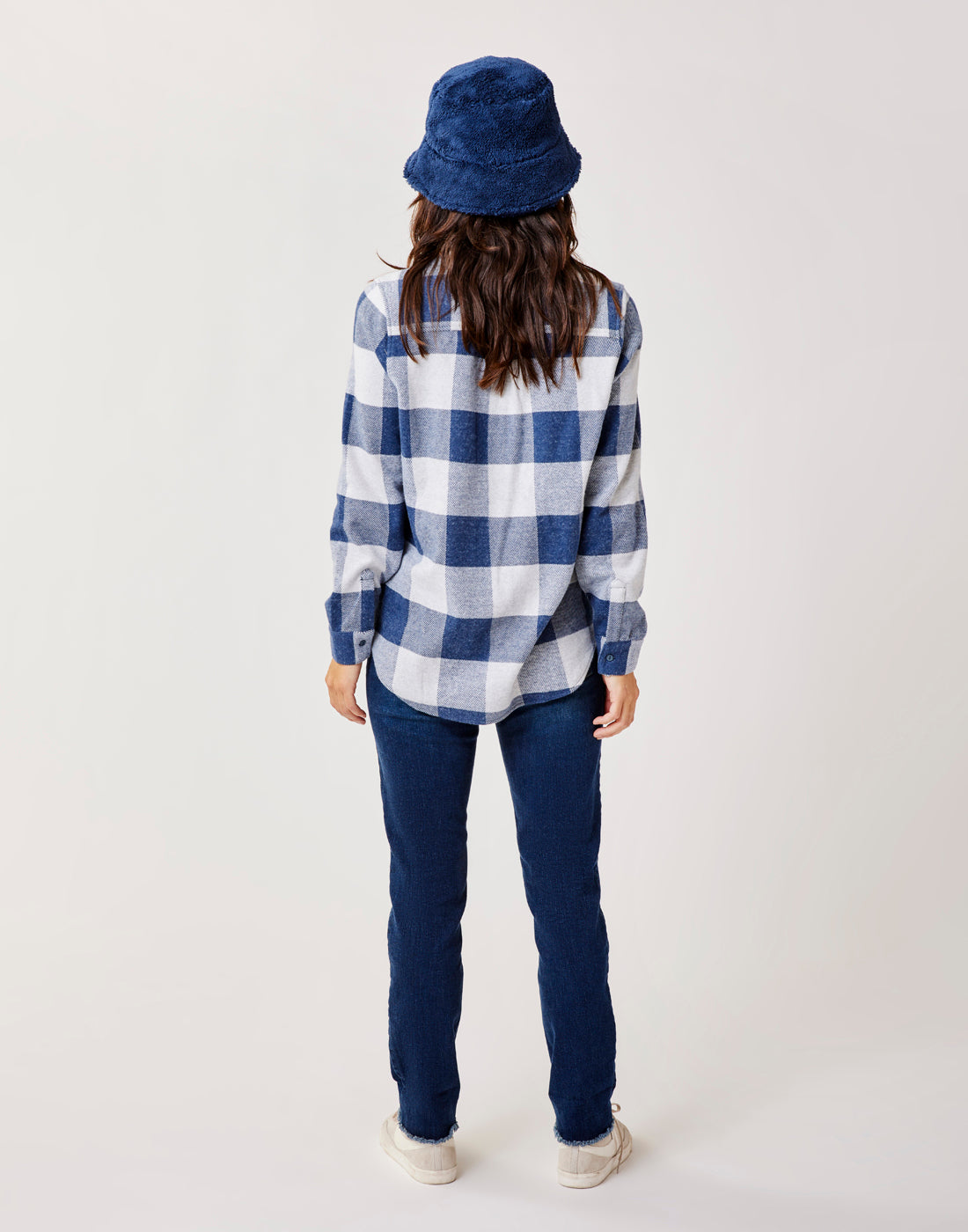 Women's plaid flannel shirt in navy and white check, back view, long sleeves