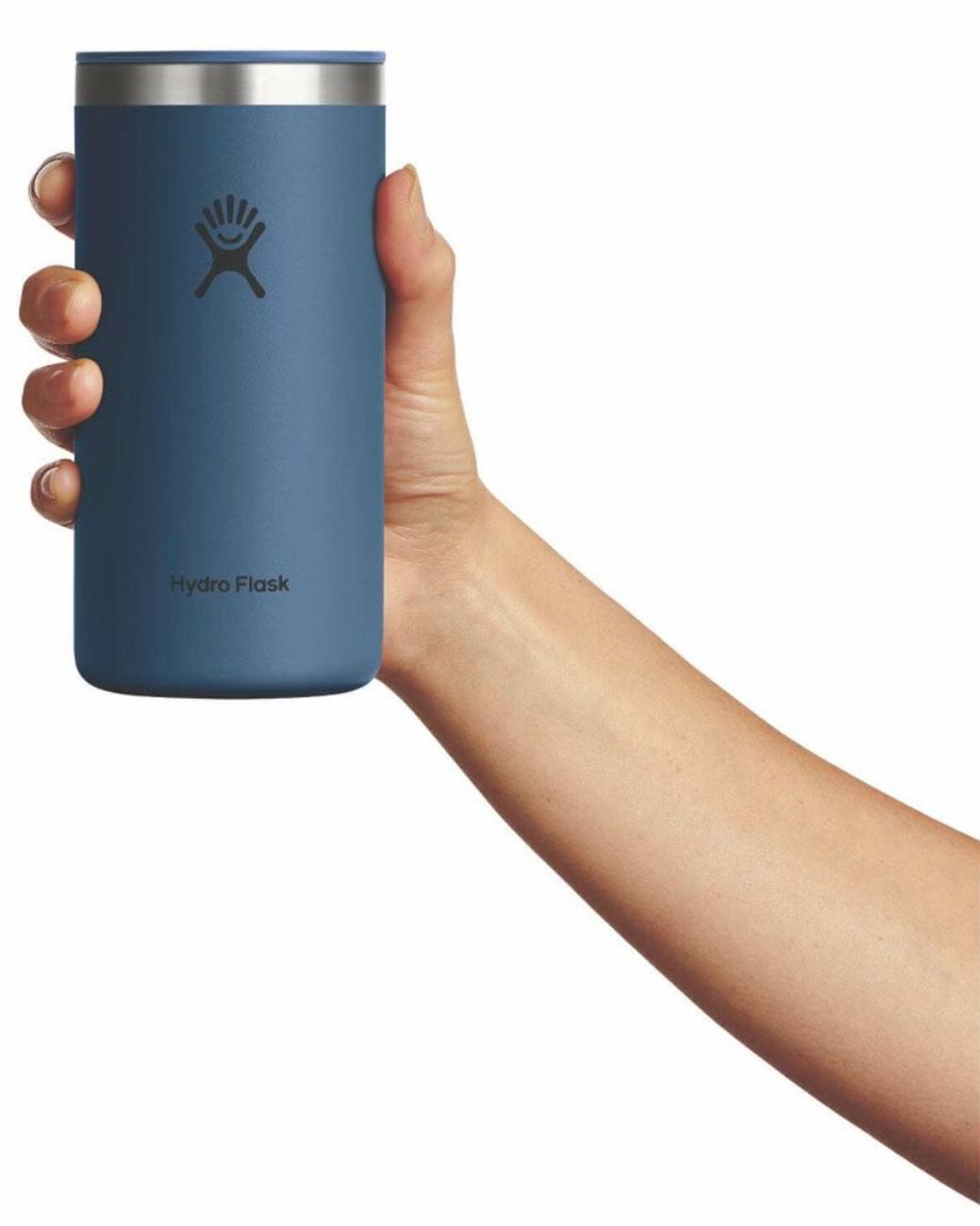 Hand holding a dark blue insulated tumbler cup with silver lid, front view