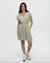 Short-sleeve wrap dress in sage green with white floral pattern, worn by model